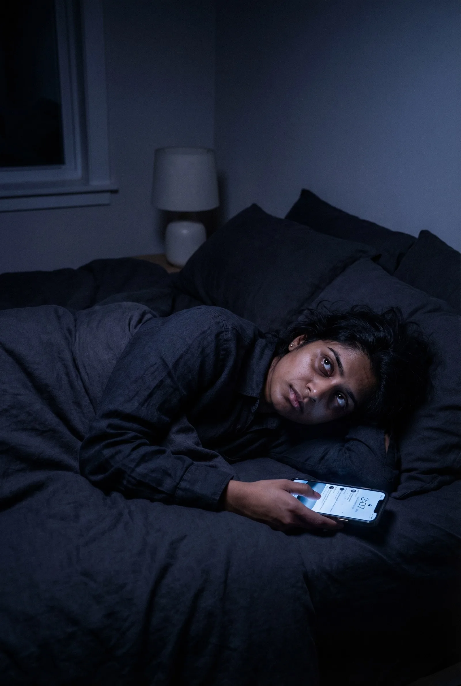 Person unable to sleep despite exhaustion